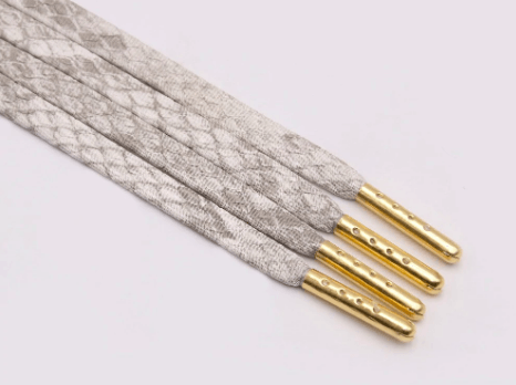 Lacets plats gris blanc marbrés serpent luxe
