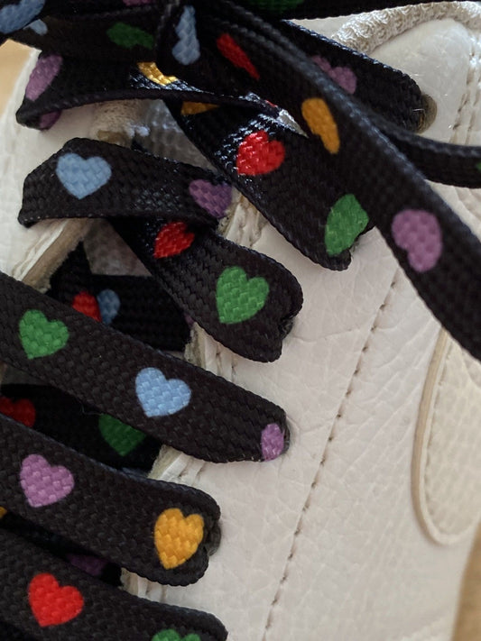Multicolor heart laces on a black background