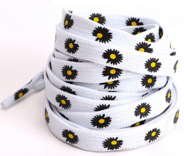 White flat laces with black daisies