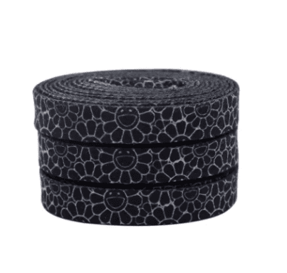 Light grey pop flower laces on a black background