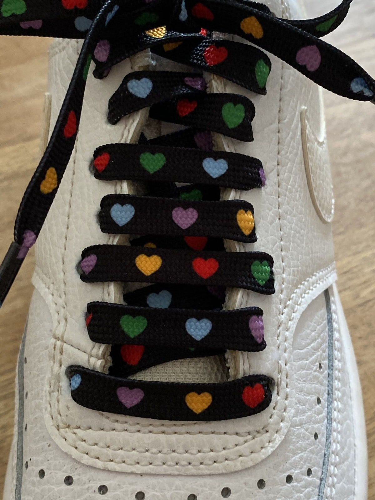 Multicolor heart laces on a black background