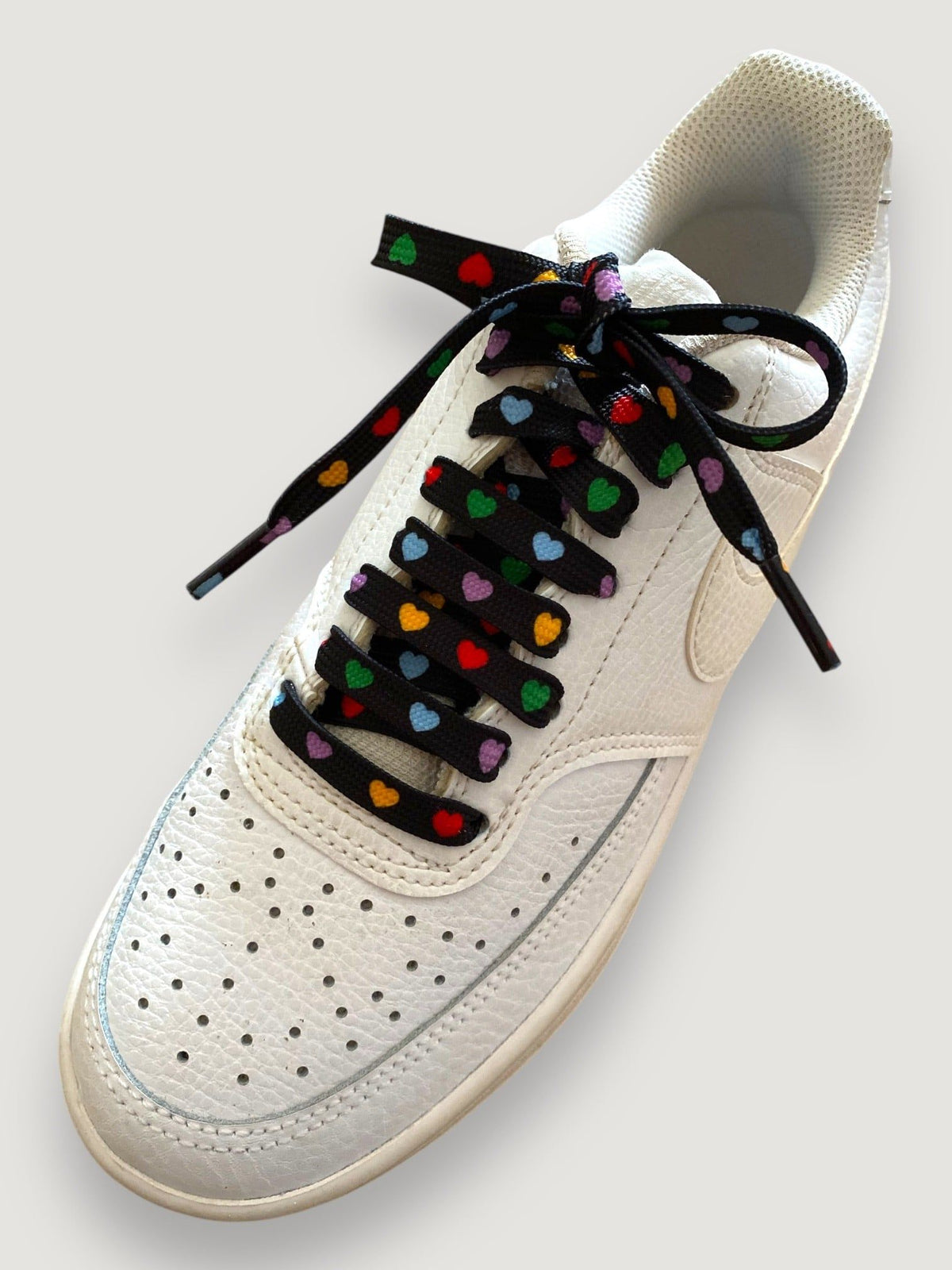 Multicolor heart laces on a black background