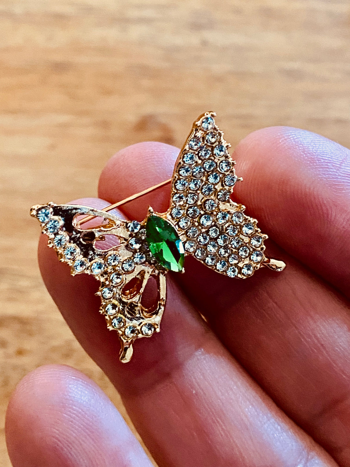 Small gold rhinestone butterfly brooch, green center